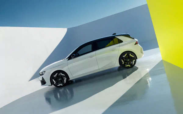 HD desktop wallpaper featuring a sleek white Opel Astra GSe in an abstract setting with clean lines and vibrant lighting.