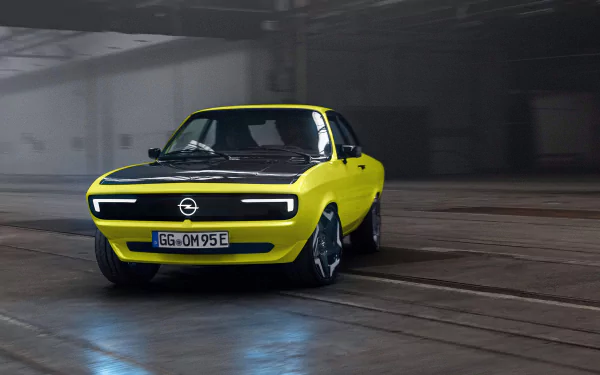 Opel Manta GSe in a high-definition desktop wallpaper and background, featuring a yellow car with sleek, modern design in an industrial setting.