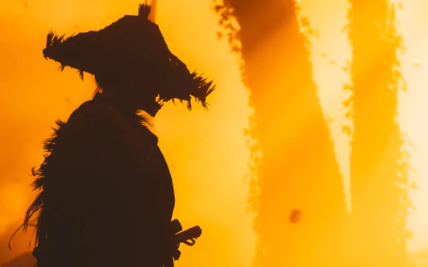 HD desktop wallpaper featuring a dramatic silhouette of a samurai from the video game Ghost of Tsushima, set against an intense, fiery background.