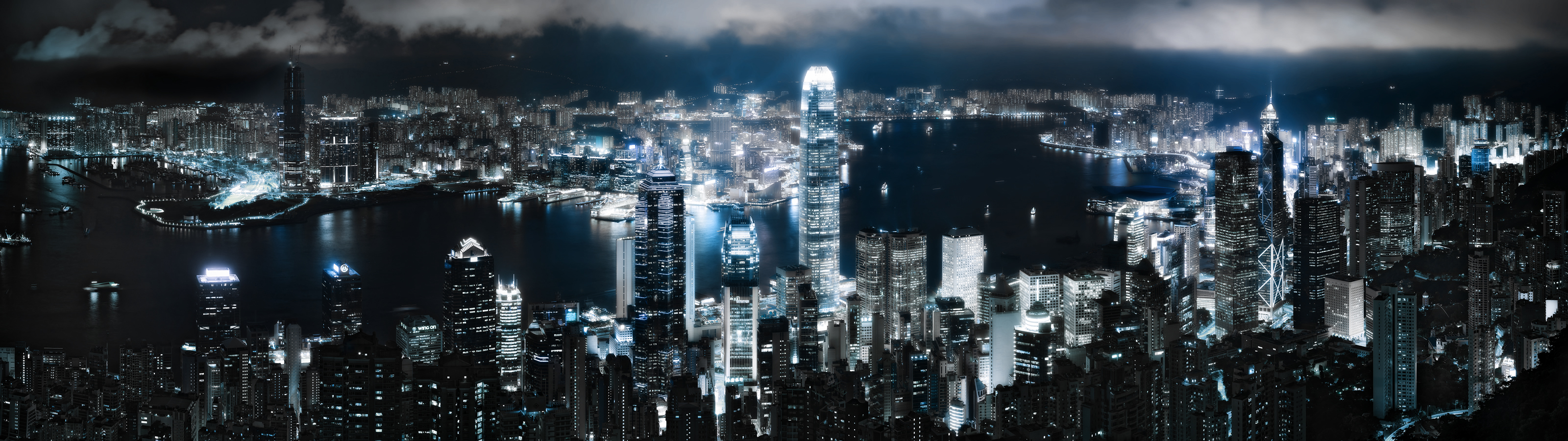 Blue skyline of Hong Kong cityscape with skyscrapers as a stunning desktop wallpaper view.