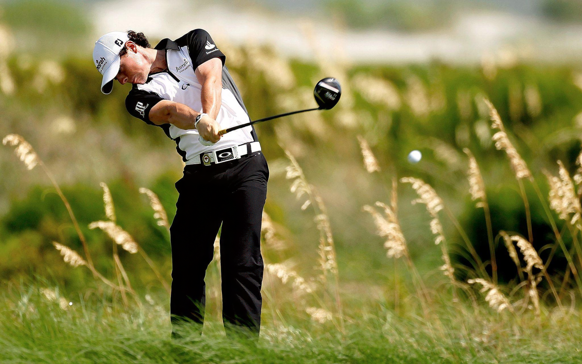 HD desktop wallpaper featuring golfer Rory McIlroy in action, capturing the essence of sports and golf.