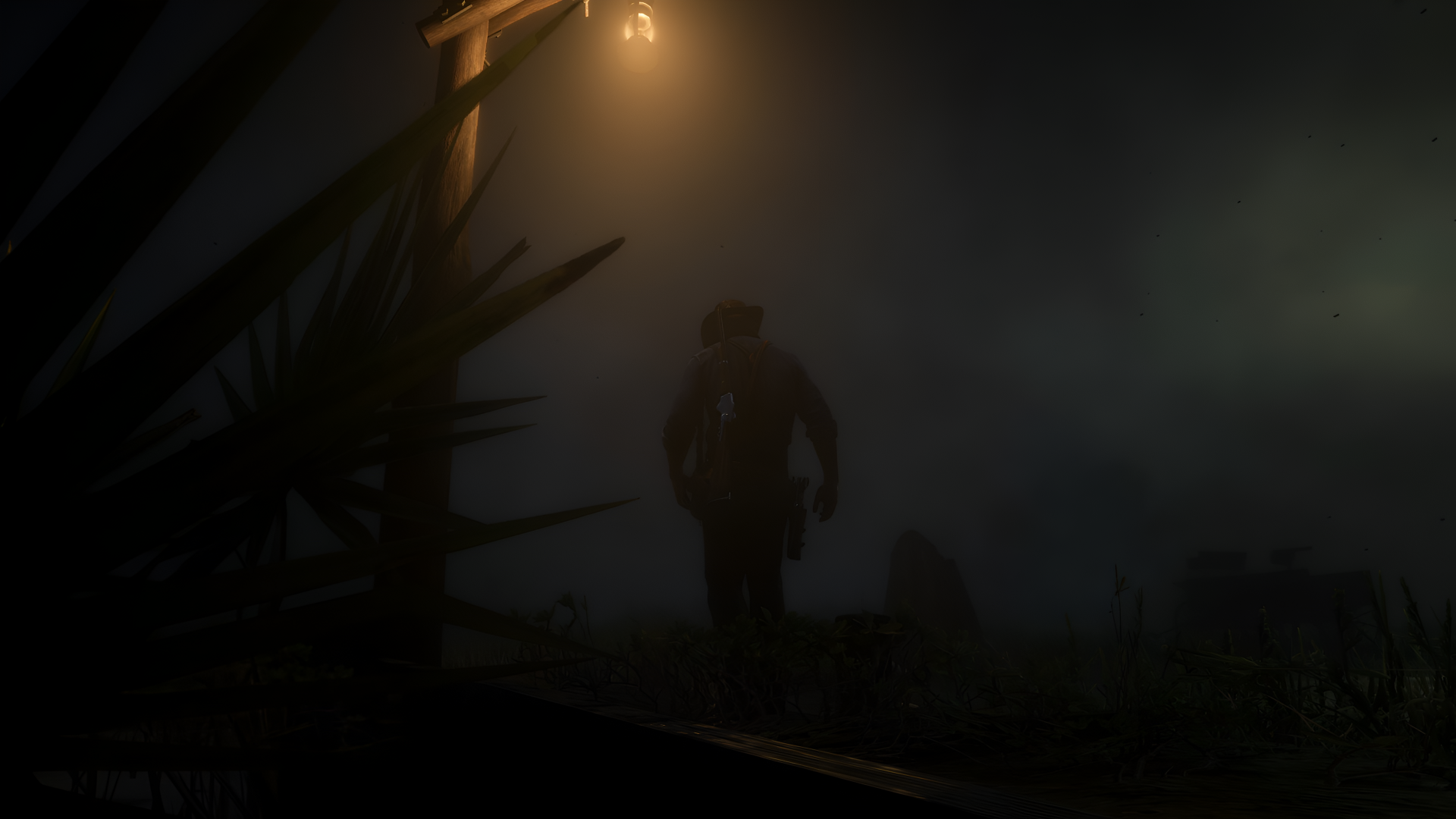 Arthur Morgan from Red Dead Redemption 2 walks through a foggy, dimly lit landscape in this atmospheric 4K Ultra HD PC desktop wallpaper.