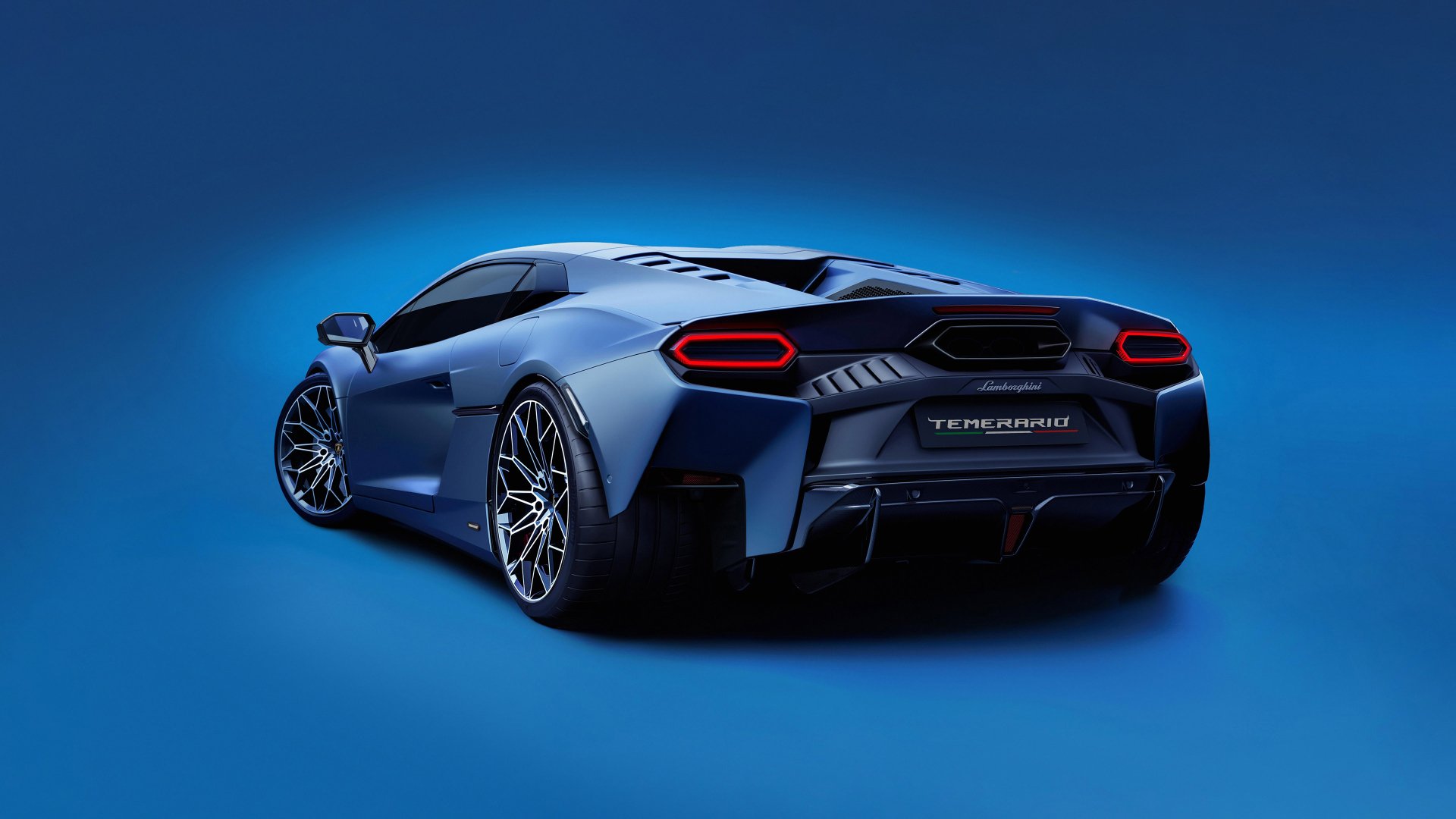 A sleek Lamborghini Temerario sports car is showcased against a vibrant blue background, emphasizing its dynamic design and modern aesthetics in this HD desktop wallpaper.