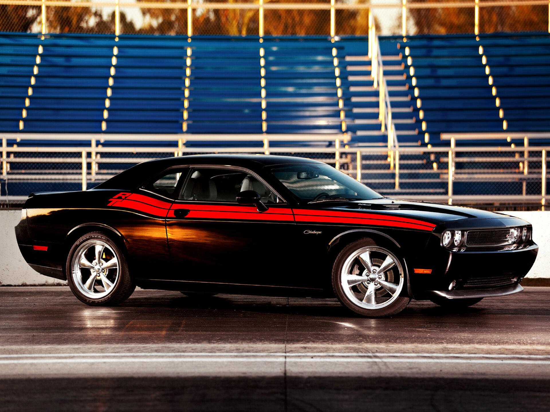 A stunning HD wallpaper featuring a classic Dodge Challenger R/T, showcasing its timeless design and powerful presence on the road. A must-have for car enthusiasts.