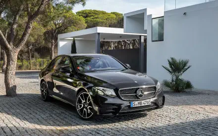 High-definition wallpaper featuring a sleek Mercedes-Benz E43 AMG, showcasing its luxury and performance. Enhance your desktop with this stunning automotive image.