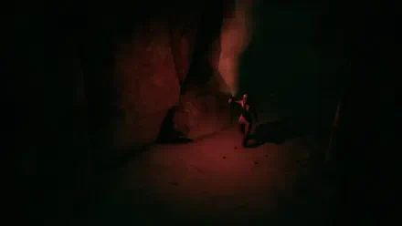 A dark, atmospheric scene from the video game Hollowbody, featuring a character exploring a cave with a flashlight, creating an eerie yet captivating background for a PC desktop wallpaper.
