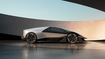 A sleek Lotus Theory 1 car is showcased against a modern architectural backdrop, presented as a stunning 4K Ultra HD desktop wallpaper.