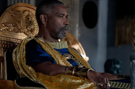 Denzel Washington sits majestically on a throne in this striking HD wallpaper from Gladiator II, showcasing a powerful scene from the film.