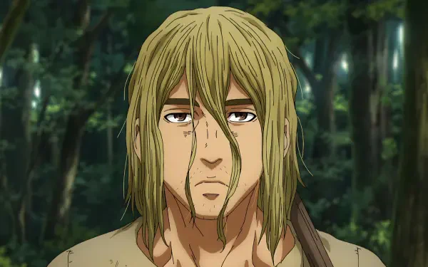 HD desktop wallpaper featuring Thorfinn from Vinland Saga, showcasing the anime character in a forested background, capturing a moment of introspection and determination.