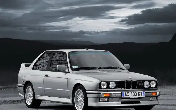 A high-definition wallpaper featuring a BMW E30 M3, showcasing its sleek design and performance as a standout vehicle in automotive culture.