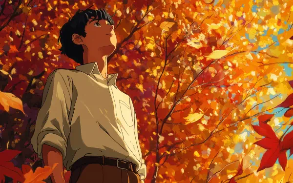 An anime boy stands beneath vibrant autumn leaves, gazing upward in a scene rich with warm colors. This 4K Ultra HD image captures the essence of the season beautifully.