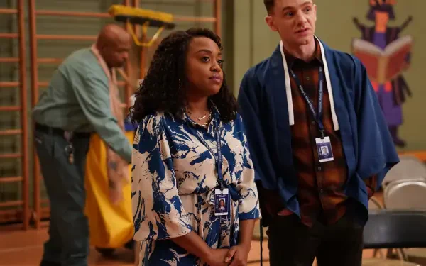 A scene from the TV show Abbott Elementary, featuring two characters in a school setting with staff members. The image serves as a vibrant HD desktop wallpaper.