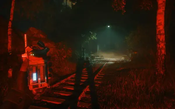 A dark, atmospheric scene from the video game A Quiet Place: The Road Ahead, featuring a blurred figure along a railway, illuminated by eerie light in a dense forest setting.