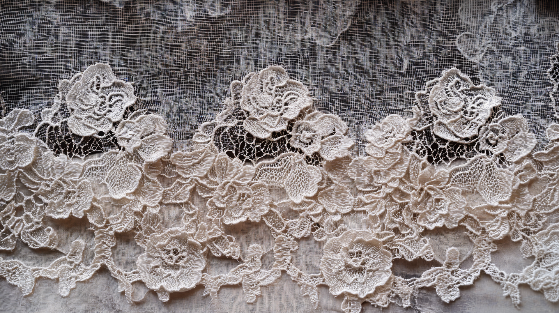 Intricate lace pattern featuring floral motifs, displayed in a detailed 4K Ultra HD format. This wallpaper captures the elegance of lacework with its delicate textures.