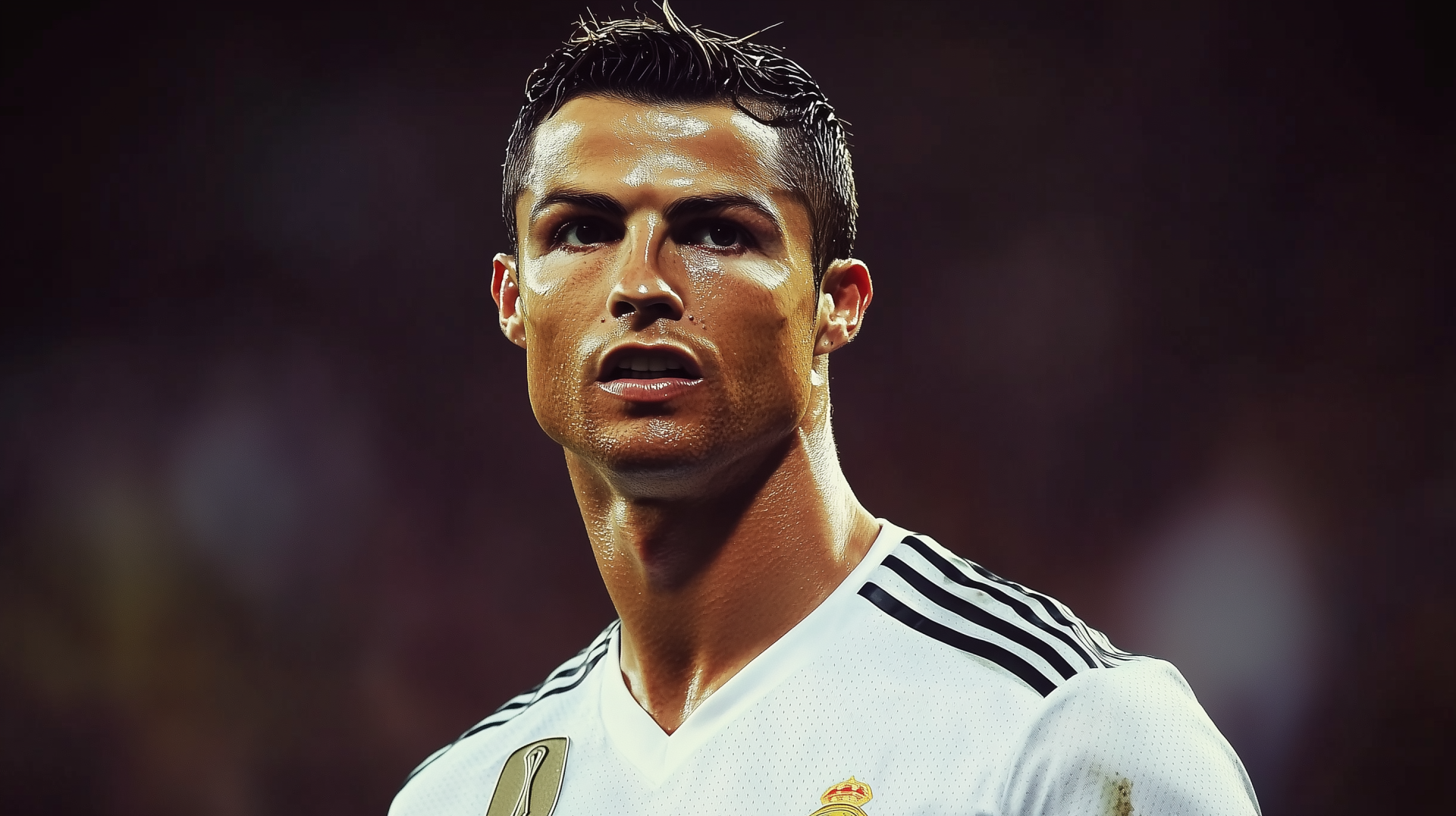 Cristiano Ronaldo in a striking pose, captured in a high-definition sports wallpaper. The soccer star's focused expression showcases his dedication and passion for the game.
