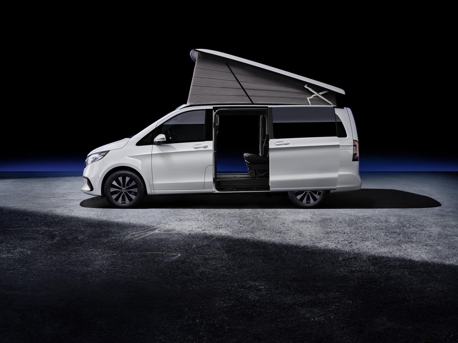 A sleek white Mercedes-Benz V-Class Marco Polo with a raised roof, showcasing its spacious interior against a dramatic dark background, presented as a 4K Ultra HD desktop wallpaper.