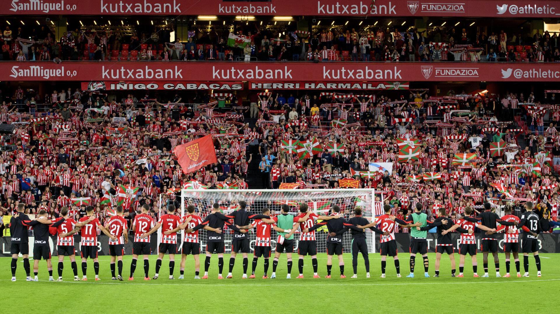 Athletic Club players celebrate with fans at a packed stadium, showcasing the vibrant atmosphere of soccer, making this an engaging HD PC desktop wallpaper.