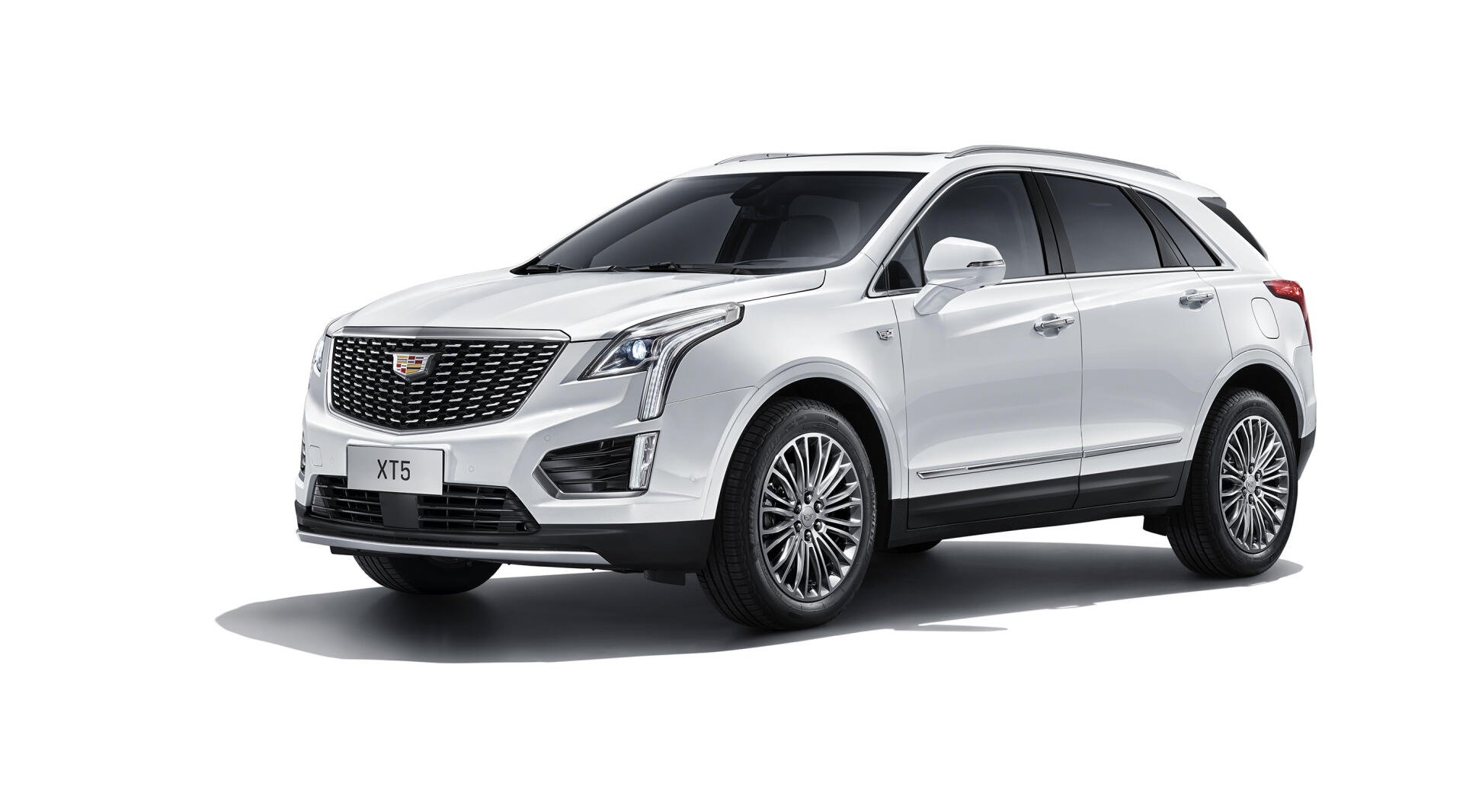 White Cadillac XT5 SUV displayed in high definition as a sleek PC desktop wallpaper and background.