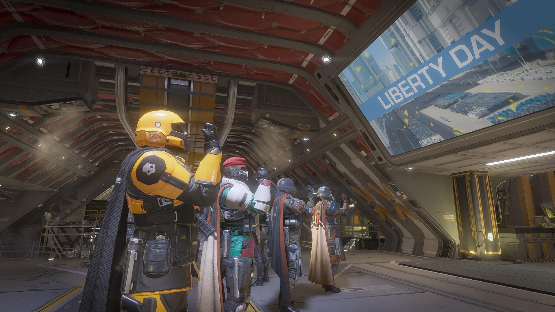 A group of characters from Helldivers 2 stands inside a futuristic spacecraft, showcasing a vibrant HD PC desktop wallpaper with a backdrop promoting Liberty Day.