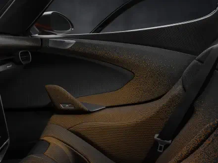 Close-up view of the sleek interior design of the McLaren W1, showcasing its luxurious materials and modern aesthetics in an 8K Ultra HD desktop wallpaper.