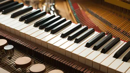 A close-up of a piano keyboard with black and white keys, set against a detailed background, creates a chill lofi atmosphere in this 4K Ultra HD desktop wallpaper.