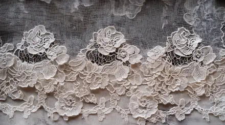 Intricate lace pattern featuring floral motifs, displayed in a detailed 4K Ultra HD format. This wallpaper captures the elegance of lacework with its delicate textures.