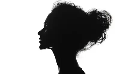 Silhouette of a woman's feminine profile with hair tied up, captured in sharp black and white, presented as a 4K Ultra HD PC desktop wallpaper and background.