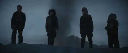 A dramatic scene from the TV show Star Wars: Skeleton Crew, featuring characters standing against a dark, swirling backdrop, creating a captivating HD wallpaper for fans.