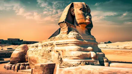 A stunning 4K Ultra HD desktop wallpaper featuring the iconic Sphinx, showcasing its majestic form against a vibrant sunset sky and the serene desert landscape.