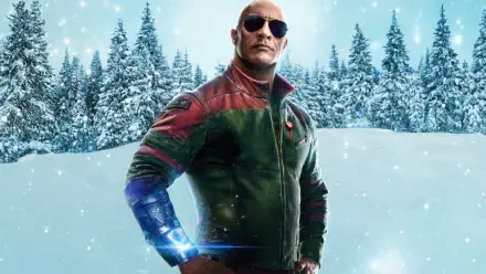 Dwayne Johnson stands confidently in a snowy landscape, wearing sunglasses and a stylish jacket, featured in the movie Red One. This stunning 4K Ultra HD wallpaper captivates with its vibrant colors.