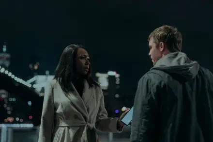 A scene from the TV show The Night Agent featuring Amanda Warren, showing a tense conversation at night with city lights in the background. HD desktop wallpaper and background.