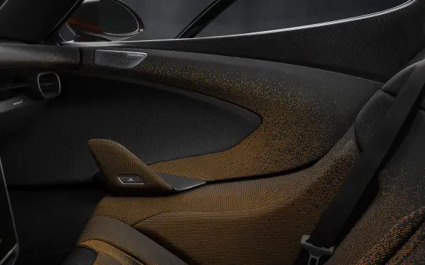 Close-up view of the sleek interior design of the McLaren W1, showcasing its luxurious materials and modern aesthetics in an 8K Ultra HD desktop wallpaper.