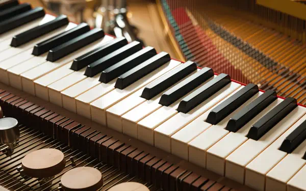 A close-up of a piano keyboard with black and white keys, set against a detailed background, creates a chill lofi atmosphere in this 4K Ultra HD desktop wallpaper.