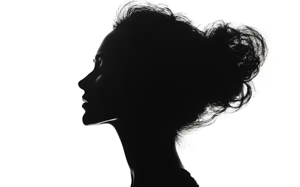 A striking feminine silhouette of a woman set against a light background, perfect as a 4K Ultra HD desktop wallpaper.