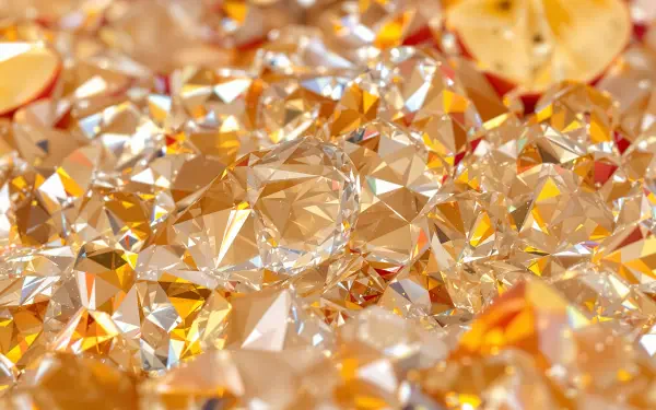 A dazzling array of golden and amber gemstones, showcasing intricate facets and brilliant reflections, designed as a stunning 4K Ultra HD PC desktop wallpaper.