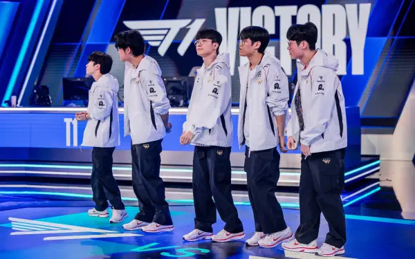 A team of esports players from T1 stands in celebration after a victory, showcasing the competitive spirit of League of Legends, with Faker among them. HD wallpaper for fans.