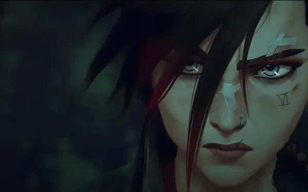 Close-up of VI from Arcane, with fierce determination in her eyes. This HD wallpaper captures the intensity of the character from Arcane Season 2, set in the League of Legends universe.