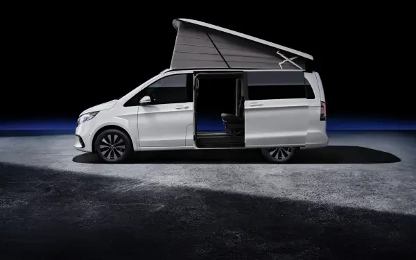 A sleek white Mercedes-Benz V-Class Marco Polo with a raised roof, showcasing its spacious interior against a dramatic dark background, presented as a 4K Ultra HD desktop wallpaper.