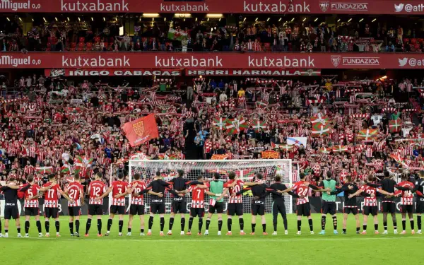 Athletic Club players celebrate with fans at a packed stadium, showcasing the vibrant atmosphere of soccer, making this an engaging HD PC desktop wallpaper.