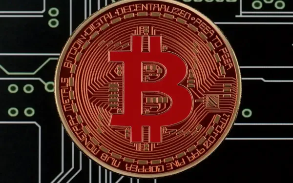 A high-definition PC desktop wallpaper featuring a detailed Bitcoin symbol against a backdrop of circuit patterns, representing the cryptocurrency theme.