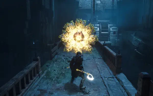 A character in Hell is Us stands on a crumbling pathway, wielding a glowing weapon as an explosion of energy surrounds them, creating a dramatic and intense atmosphere.