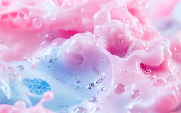 Close-up of colorful kefir bubbles in soft pink and blue hues, showcasing a vibrant and textured surface. 4K Ultra HD desktop wallpaper and background.