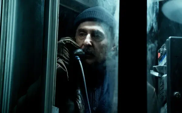 A dramatic scene from the TV show *Severance*, featuring a character in a phone booth, shrouded in mist, conveying a sense of tension and intrigue in this 4K Ultra HD wallpaper.