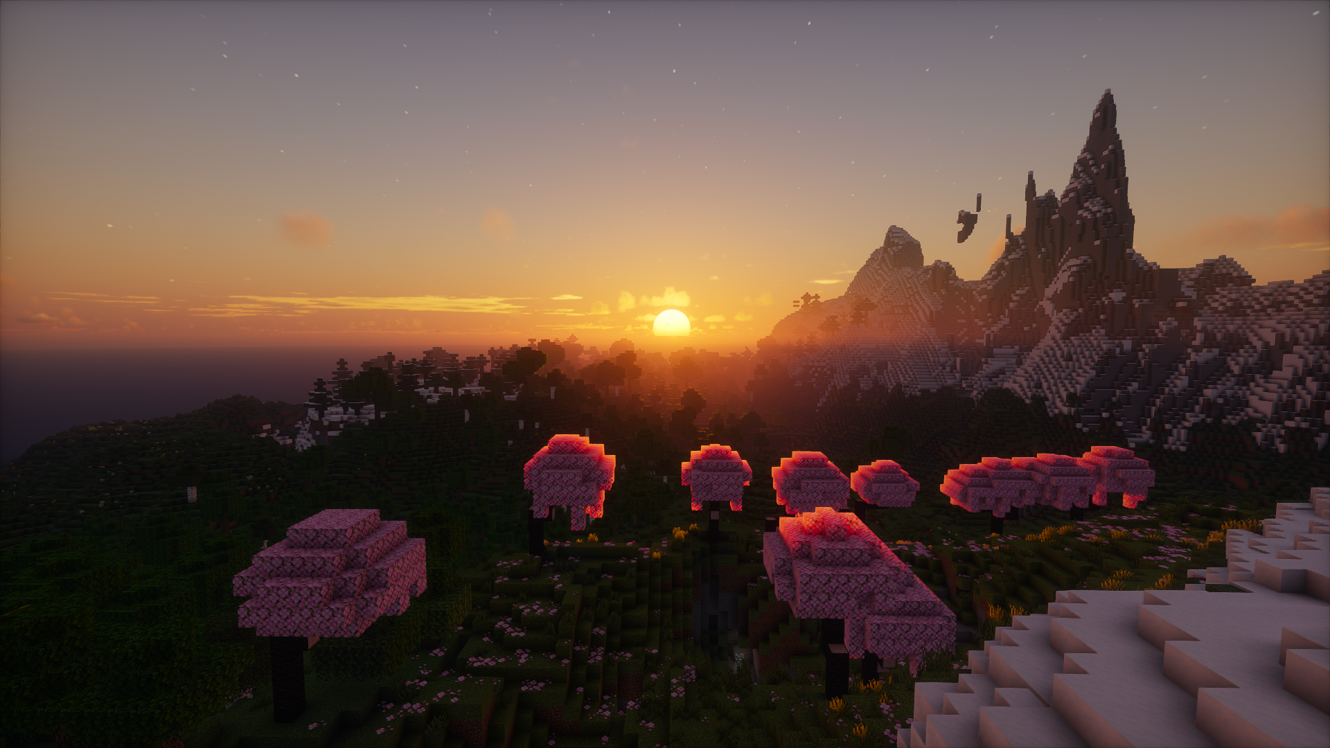 HD Minecraft PC desktop wallpaper showcasing a sunset over a pixelated landscape with pink trees and mountainous terrain in the distance.