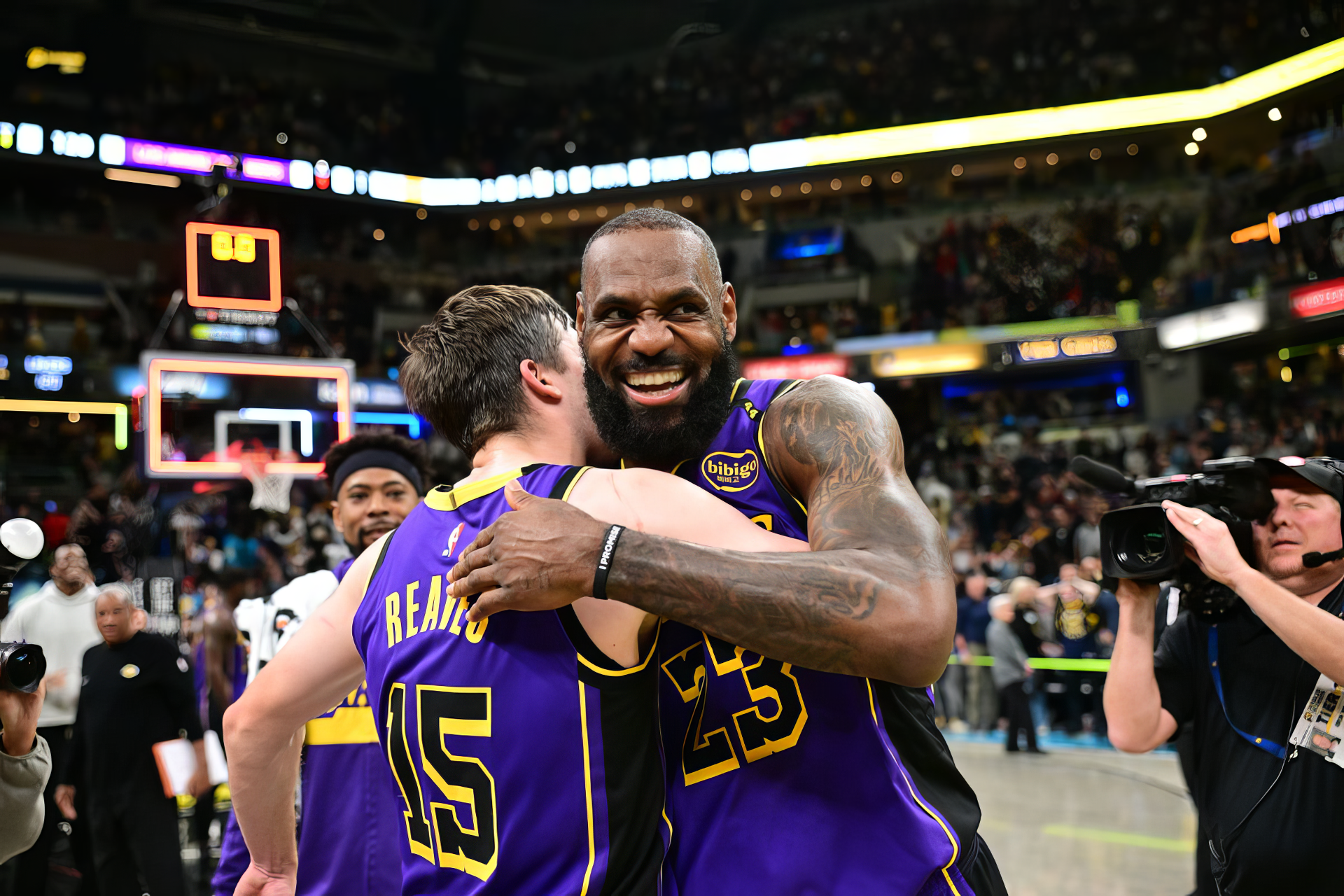 LeBron James and Austin Reaves celebrate a thrilling moment on the court, showcasing their chemistry as members of the Los Angeles Lakers in this vibrant HD wallpaper.
