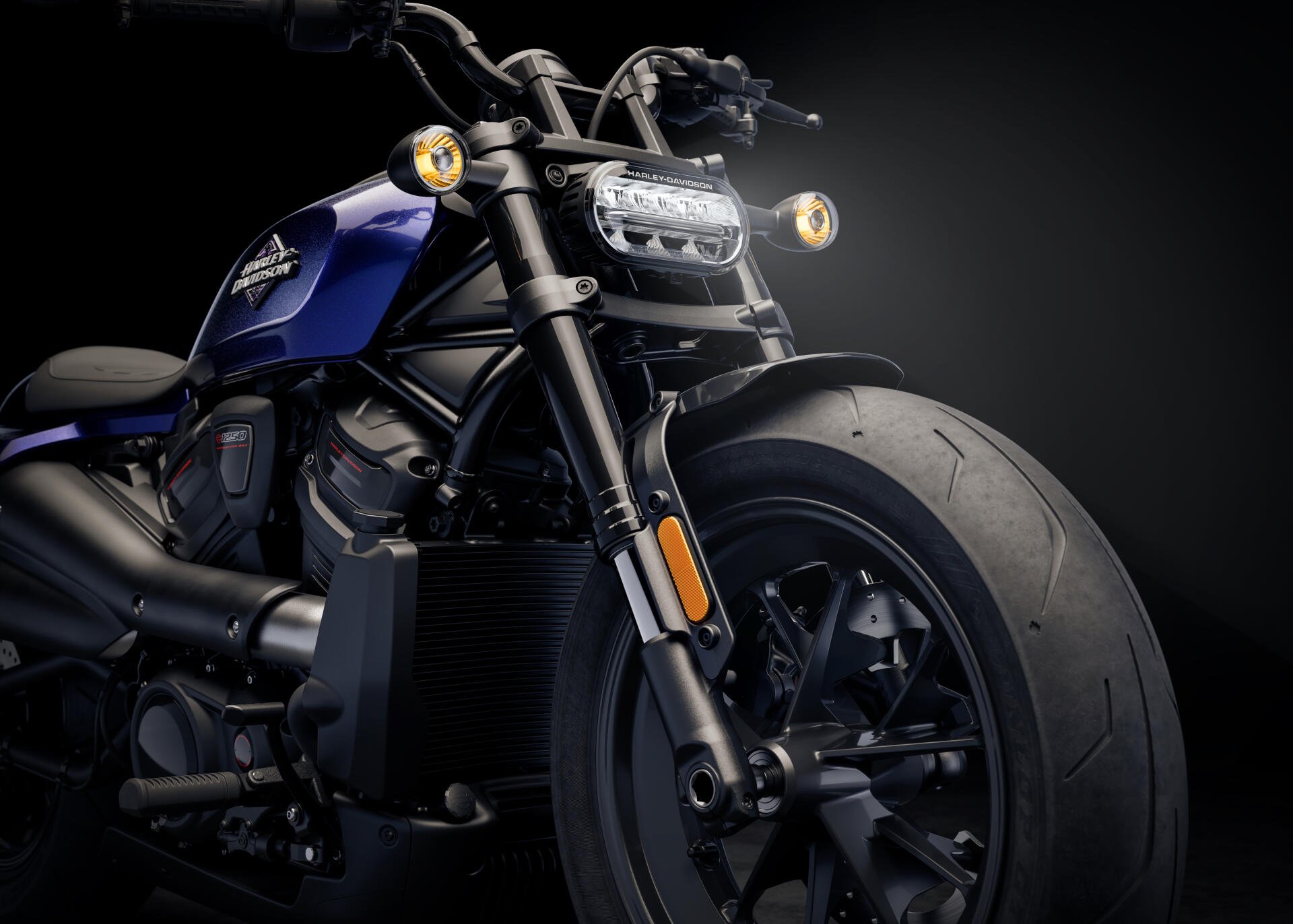 Close-up of a blue Harley-Davidson Sportster motorcycle front wheel and handlebars, captured in 4K Ultra HD for a PC desktop wallpaper background.