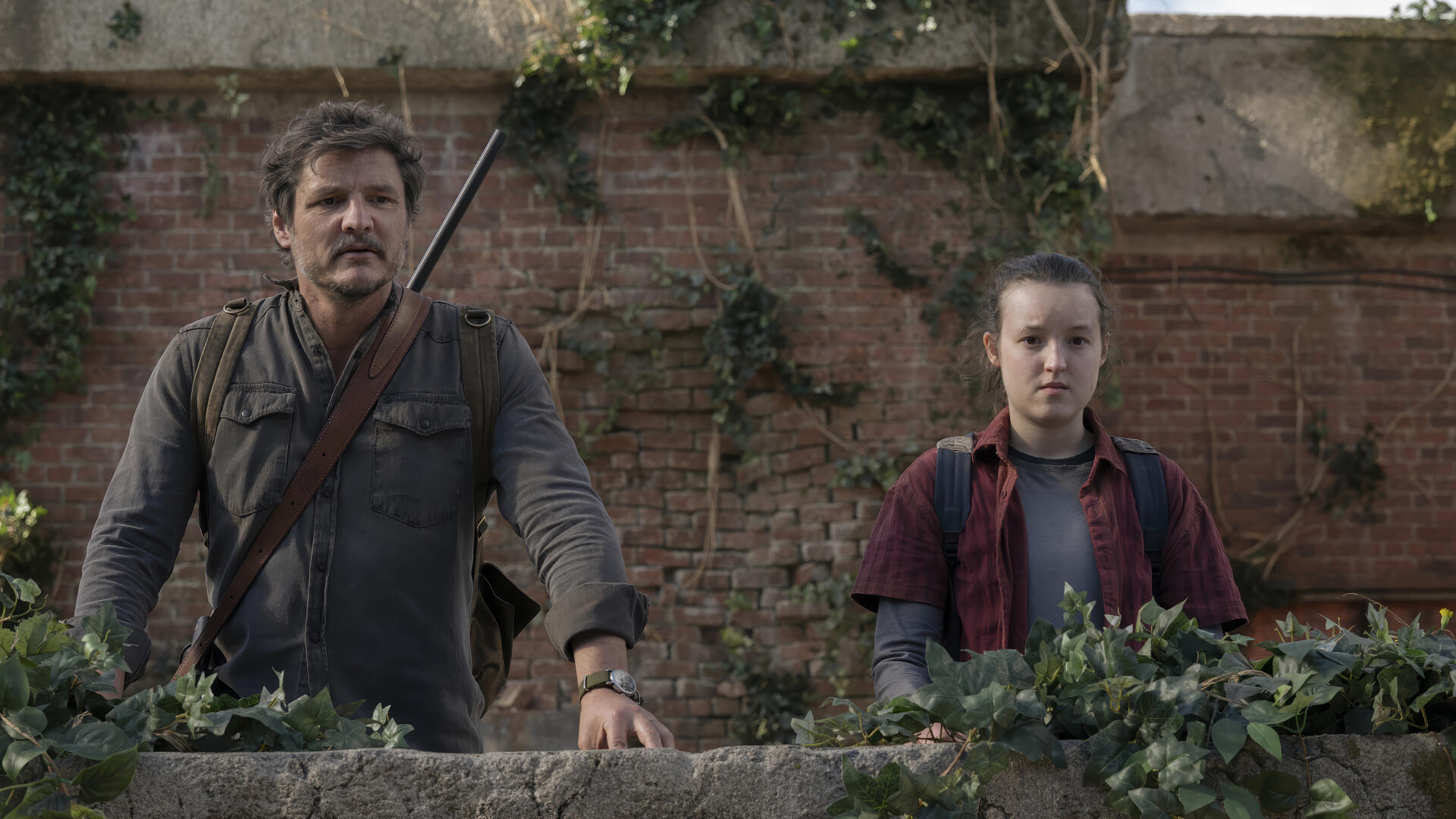 4K Ultra HD wallpaper featuring Joel and Ellie from The Last of Us Season 2 TV show, set against a rustic brick wall with greenery.