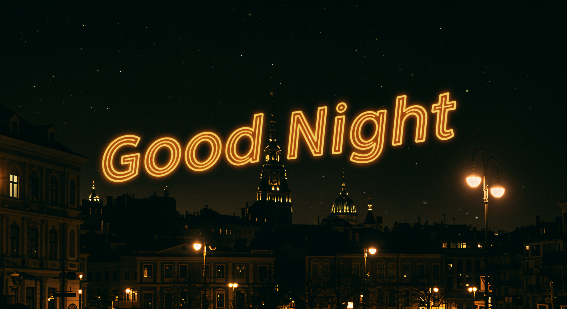 A 4K Ultra HD PC desktop wallpaper featuring a nighttime cityscape with illuminated buildings and street lamps, and the glowing Good Night text in the starry sky.