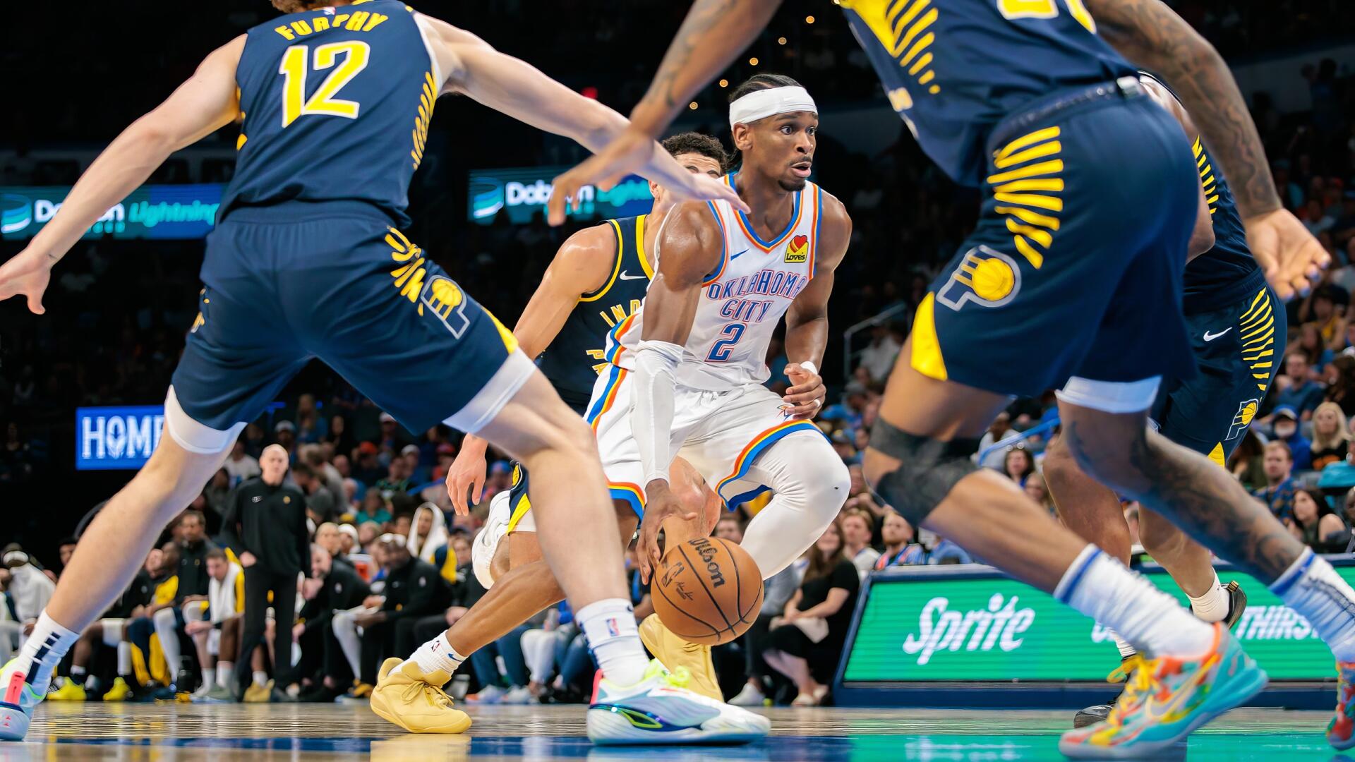 Action-packed NBA Finals moment featuring Shai Gilgeous-Alexander dribbling past defenders, captured in HD for a dynamic basketball sports wallpaper.