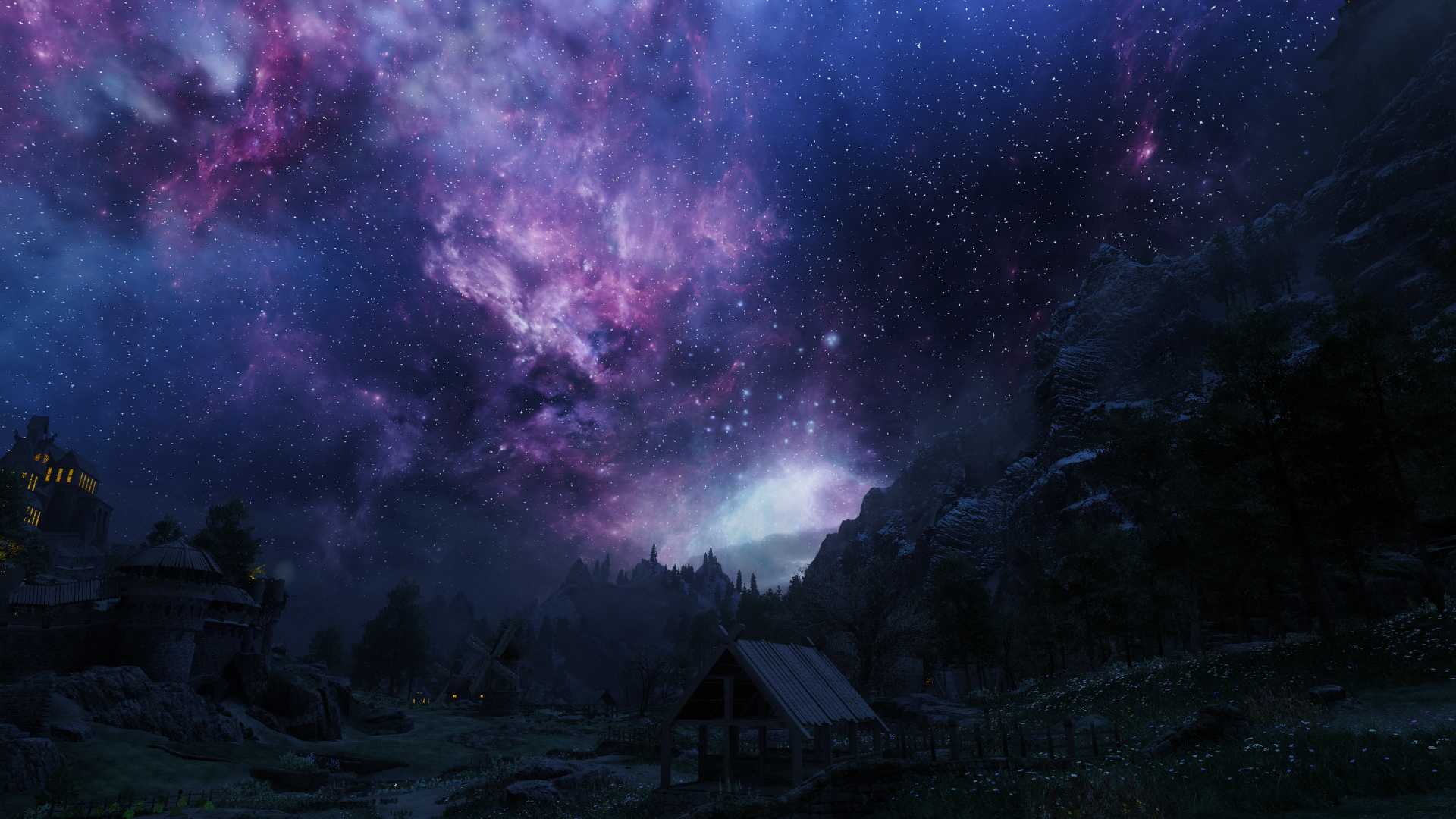 HD PC desktop wallpaper showcasing a starry night sky with vibrant nebulae over a mountainous gaming environment from The Elder Scrolls V: Skyrim.